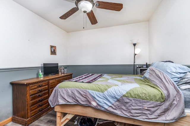 bedroom featuring wood finished floors and a ceiling fan