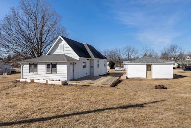 view of side of property with a lawn and a wooden deck