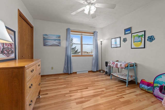 interior space with light wood-style flooring and a ceiling fan