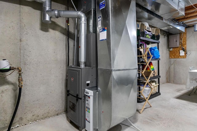 utility room with electric panel and heating unit