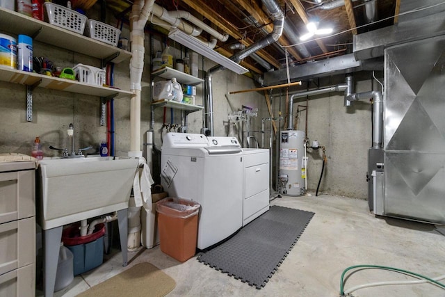 unfinished basement with heating unit, washing machine and dryer, gas water heater, and a sink