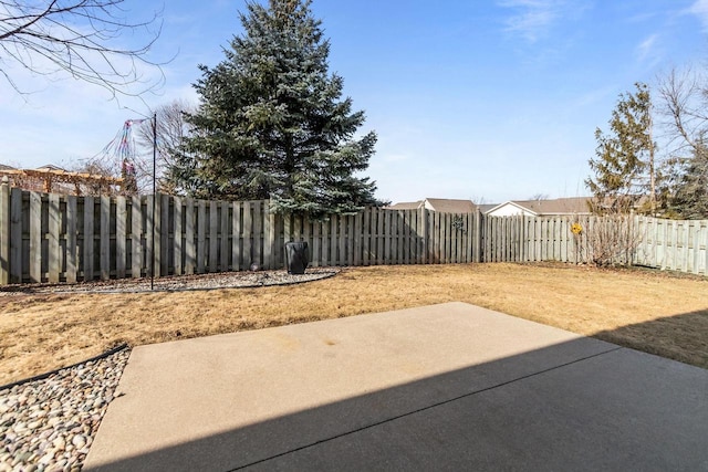 view of yard featuring a patio and a fenced backyard