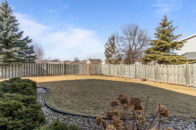 view of yard with a fenced backyard