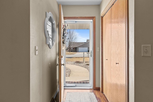 entryway with wood finished floors