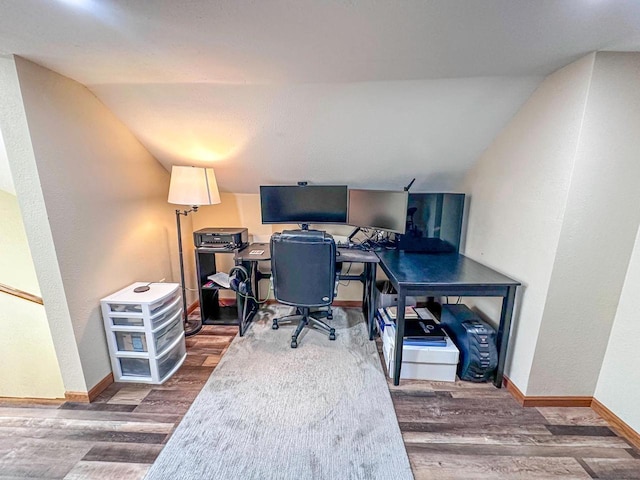 home office with lofted ceiling, baseboards, and wood finished floors