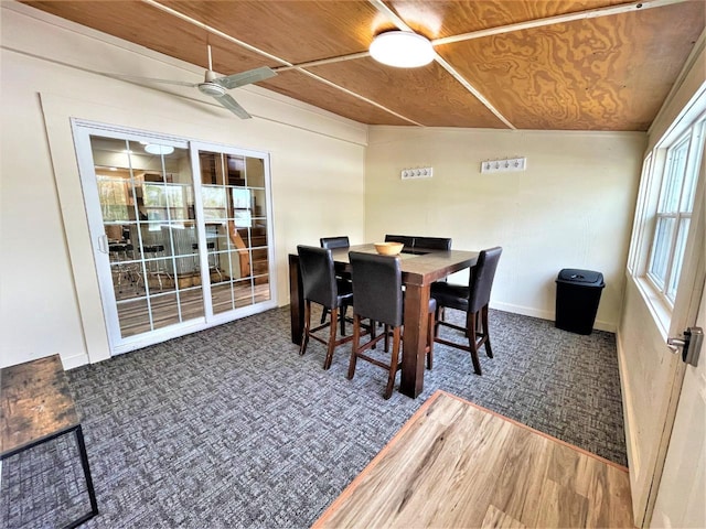 dining area with a ceiling fan, wooden ceiling, and wood finished floors