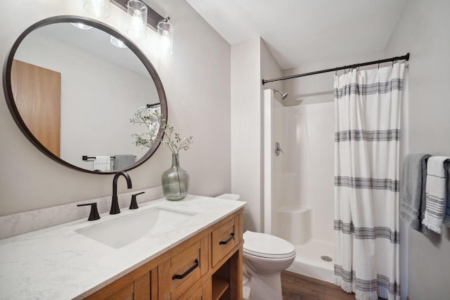 full bath featuring curtained shower, toilet, vanity, and wood finished floors