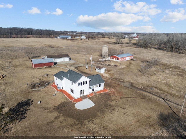 birds eye view of property featuring a rural view