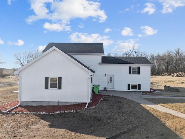 back of house with a patio area