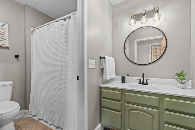 full bath with vanity, toilet, baseboards, and tile patterned flooring