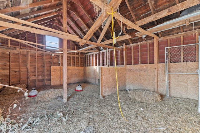 miscellaneous room with lofted ceiling