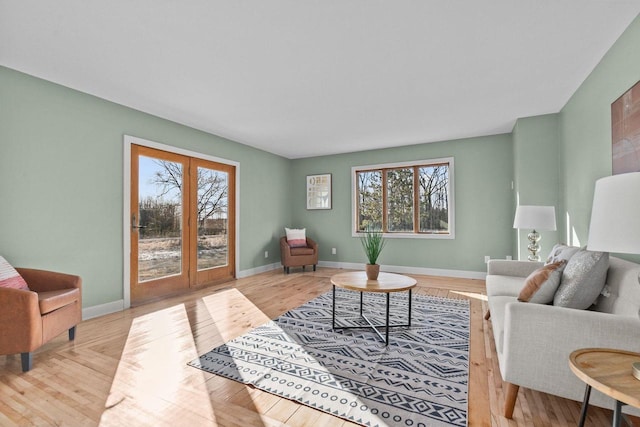 living area featuring wood finished floors and baseboards