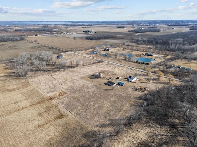 birds eye view of property featuring a rural view