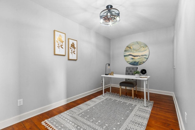 home office with baseboards and wood finished floors