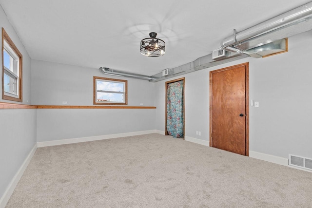 interior space featuring baseboards and visible vents