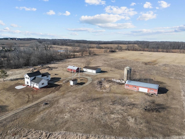 birds eye view of property with a rural view