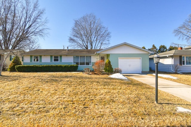 ranch-style house featuring driveway and an attached garage