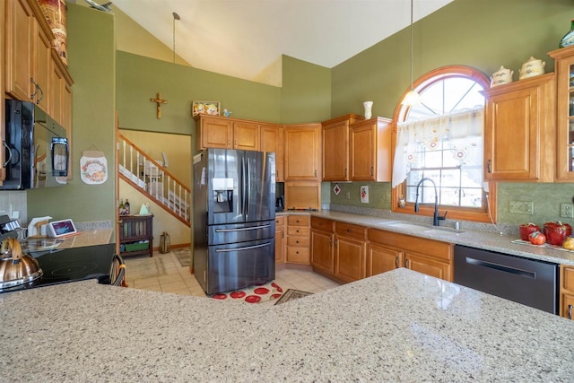 kitchen featuring high vaulted ceiling, a sink, stainless steel appliances, light tile patterned flooring, and decorative backsplash