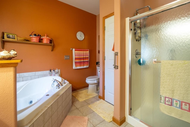 full bathroom featuring a bath, a shower stall, tile patterned floors, and toilet