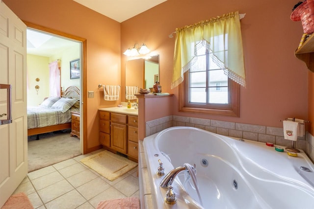 bathroom featuring vanity, tile patterned floors, a tub with jets, and connected bathroom