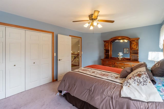 bedroom featuring a closet, carpet, and a ceiling fan