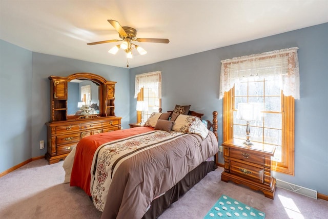 bedroom with visible vents, a ceiling fan, carpet, and baseboards