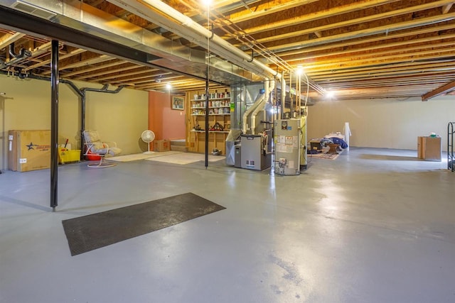 unfinished basement with water heater, heating unit, and visible vents