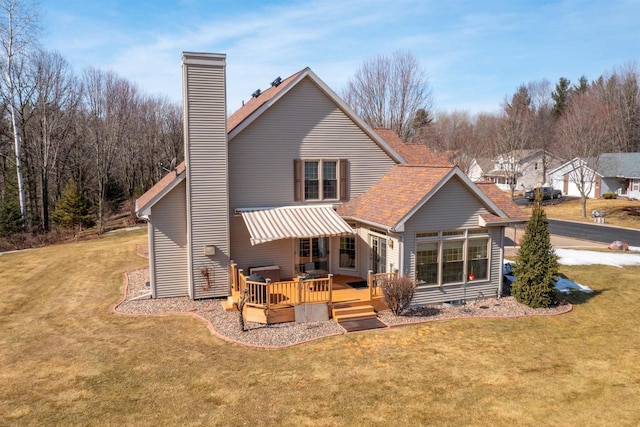 back of property with a shingled roof, a wooden deck, a lawn, a chimney, and crawl space