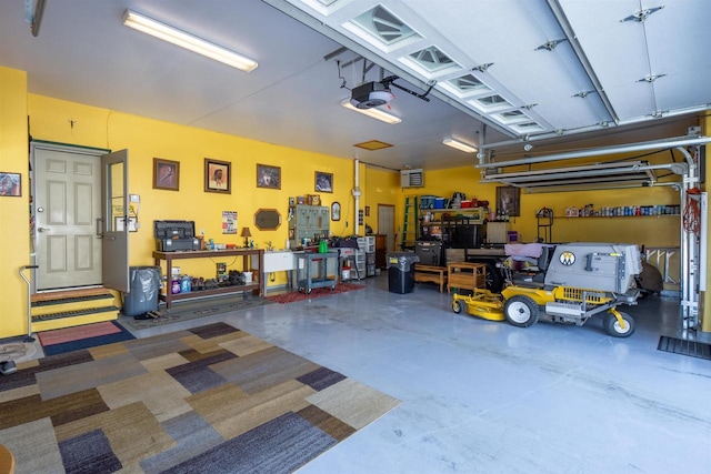 garage featuring a workshop area and a garage door opener