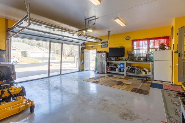 garage with freestanding refrigerator