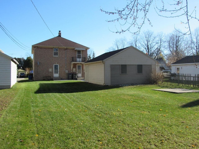 back of property featuring a lawn