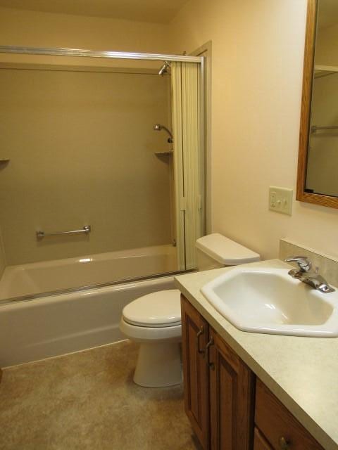 full bathroom featuring tub / shower combination, toilet, and vanity