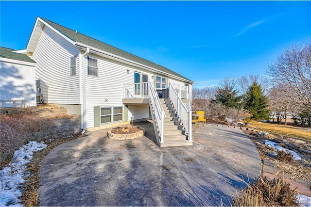 rear view of house with stairway