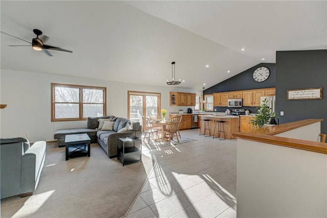 living room with high vaulted ceiling, light tile patterned flooring, recessed lighting, and ceiling fan