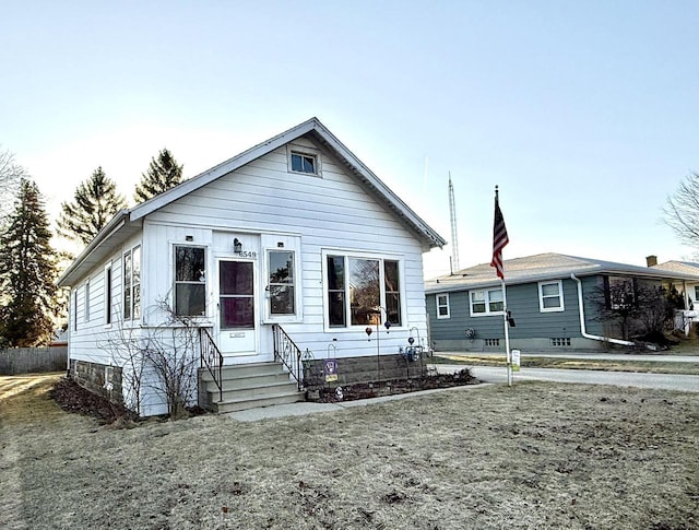 bungalow-style home with entry steps