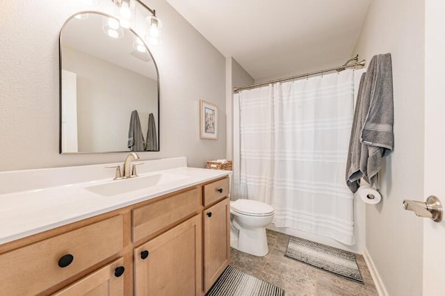 bathroom featuring curtained shower, toilet, and vanity