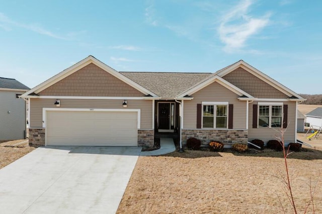 craftsman house featuring stone siding, an attached garage, and concrete driveway