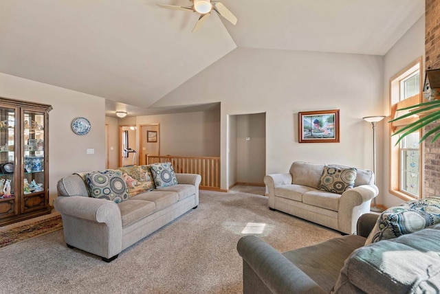 living area featuring a ceiling fan, carpet, and high vaulted ceiling