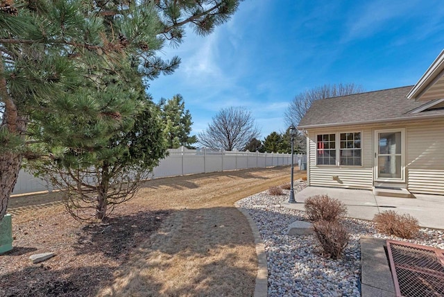 view of yard featuring a patio area and fence