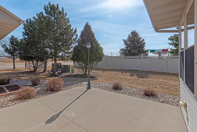 view of yard featuring a patio and fence