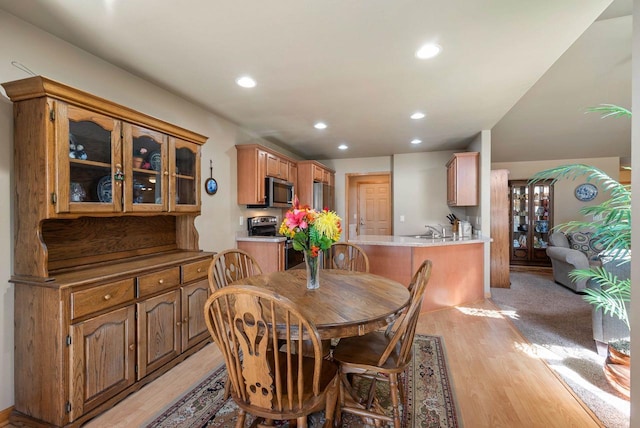 dining area featuring recessed lighting and light wood-type flooring