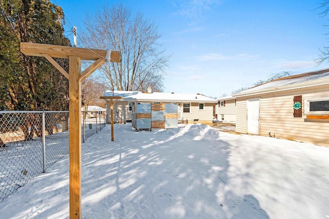 snowy yard with fence