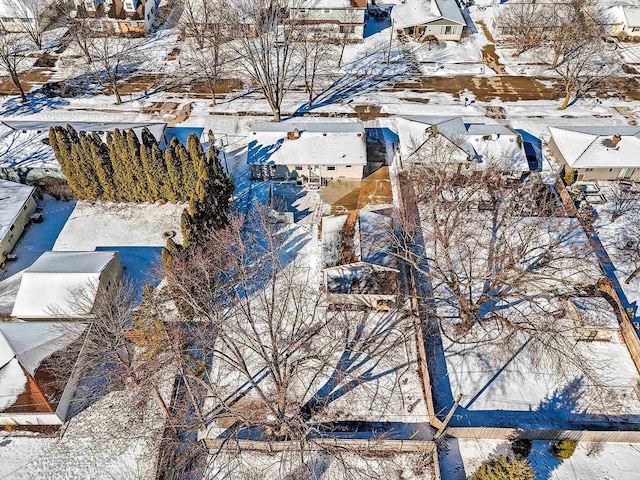 snowy aerial view with a residential view