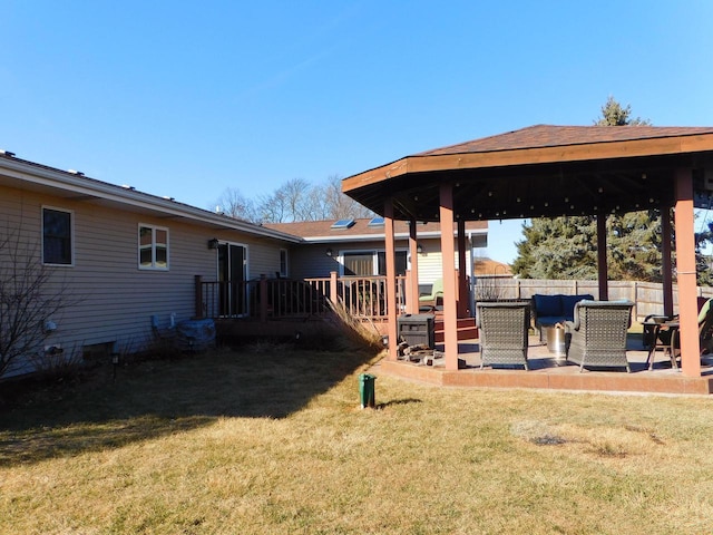 view of yard with an outdoor living space, fence, a gazebo, a deck, and a patio