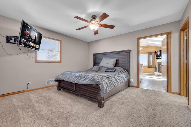 carpeted bedroom with visible vents, multiple windows, and baseboards