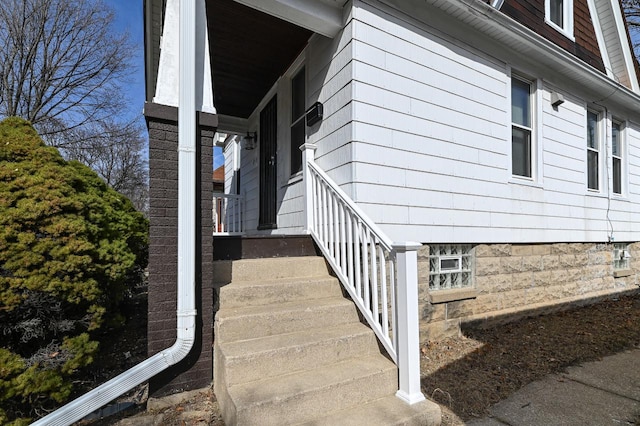 doorway to property featuring covered porch