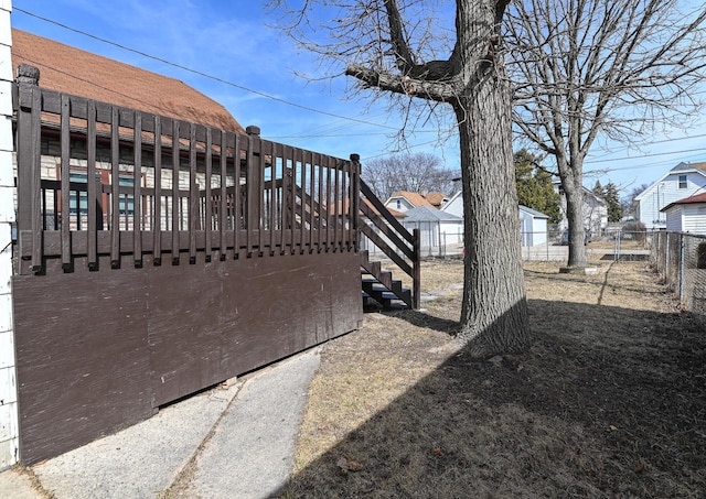 view of yard with stairs and fence