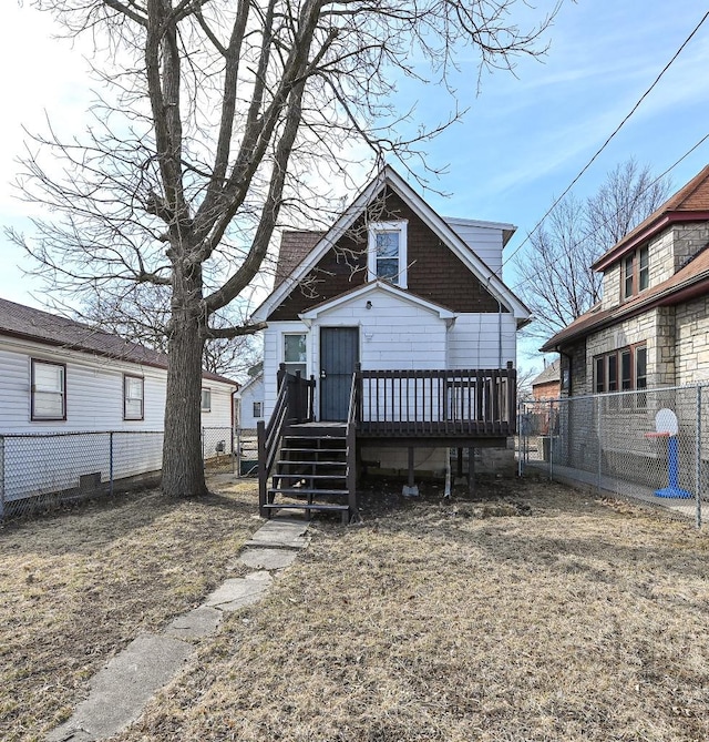 view of front of property featuring a deck and fence private yard