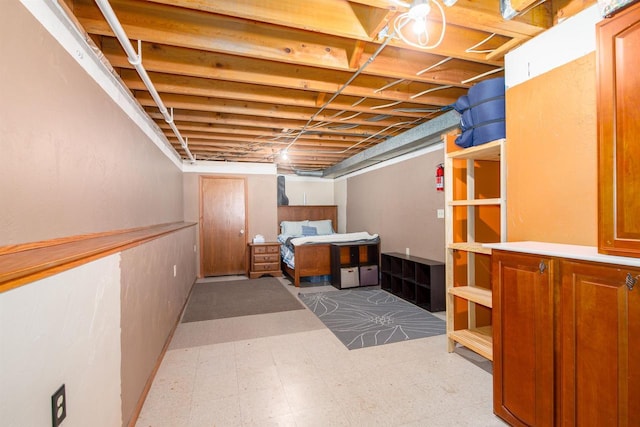 unfinished basement featuring tile patterned floors