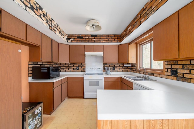 kitchen featuring black microwave, under cabinet range hood, light floors, white electric range oven, and a sink